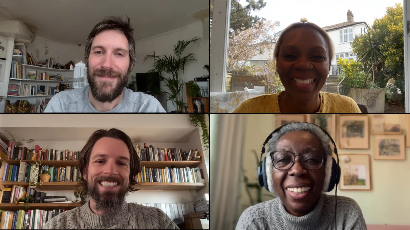 Four people smiling during a video call, shown in a 2x2 grid layout with home interiors and bookshelves visible in background.