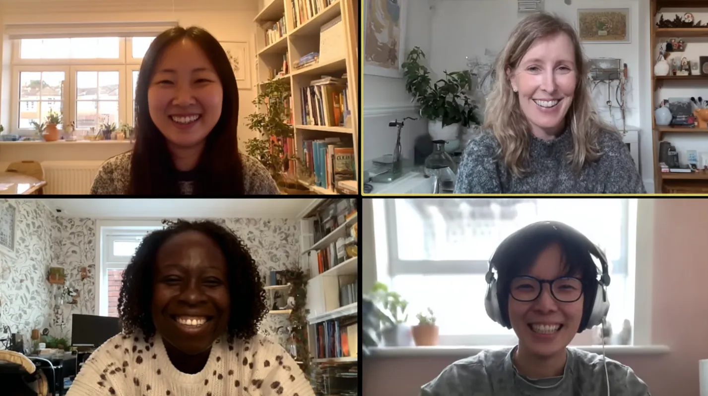Four people smiling during a video call in their home offices with bookshelves and plants visible in the background.